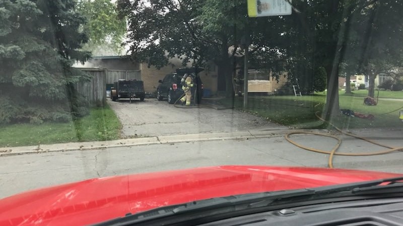Crews work to clear smoke following a fire at a home on Hines Crescent in London, Ont. on Thursday, Sept. 10, 2020. (London Fire Department) 