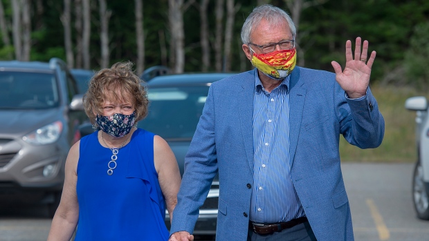 Premier Blaine Higgs arrives with his wife Marcia to vote in the New Brunswick provincial election in Quispamsis, N.B. on Monday, Sept. 14, 2020.  (THE CANADIAN PRESS/Andrew Vaughan)