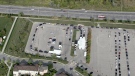 Dozens of cars are seen waiting at William Osler’s drive-thru testing centre in Etobicoke Monday. (CTV News Toronto) 