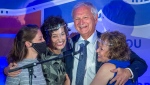 Premier Blaine Higgs embraces his wife Marcia Higgs, right, and daughters Rachel Hiltz, left and Lindsey Hiltz after winning the New Brunswick provincial election in Quispamsis, N.B. on Monday, Sept. 14, 2020.  (THE CANADIAN PRESS/Andrew Vaughan)