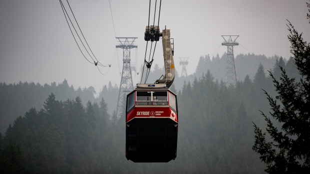 Heavy smoke and poor air quality in the Vancouver area have been caused by the wildfires burning south of the border.  <br><br>
Smoke from wildfires burning in the U.S. fills the air as the Grouse Mountain tram transports people wearing face masks down the mountain, in North Vancouver, B.C,, on Saturday, Sept. 12, 2020. (Darryl Dyck / THE CANADIAN PRESS)