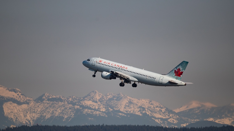 An Air Canada flight departing for Kelowna takes off at Vancouver International Airport, in Richmond, B.C., on Friday, March 20, 2020. THE CANADIAN PRESS/Darryl Dyck