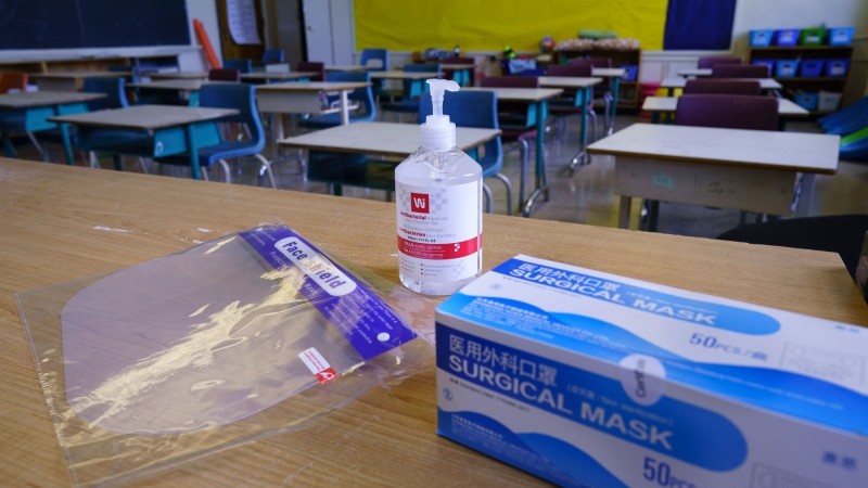 Personal protection equipment is seen on the teacher's desk in classroom in preparation for the new school year at the Willingdon Elementary School in Montreal, on Wednesday, August 26, 2020. THE CANADIAN PRESS/Paul Chiasson