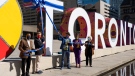 Mayor John Tory and other dignitaries are shown at a ceremony held to unveil the new Toronto sign on Friday. (Twitter/@JohnTory)