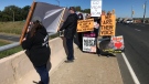 The Windsor-Detroit Animal Save group protest against the recently passed Bill 156.