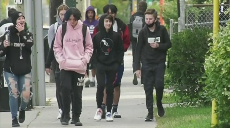 High school students walk in downtown London, Ont. on Tuesday, Sept. 22, 2020. (Marek Sutherland / CTV News)