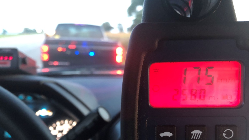 LPS Officer's radar gun reading 175 km/h for a pair of pulled over pickups. (Source: London Police Twitter)