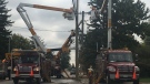 London Hydro crews repair damaged poles following an alleged impaired driving crash on Hamilton Road on Sept. 27, 2020. (Brent Lale/CTV London)