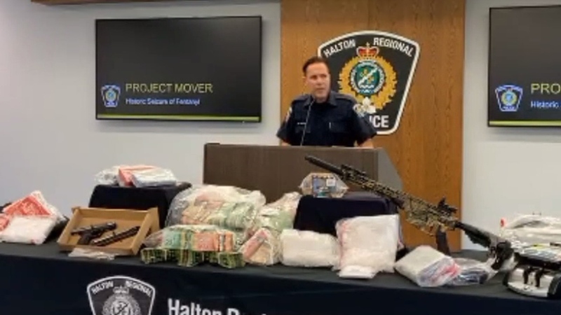 Police display drugs, cash and guns seized as part of 'Project Mover' on Sept. 28, 2020. (HRPS)