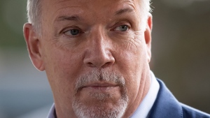 NDP Leader John Horgan pauses while speaking during a campaign stop in Coquitlam, B.C., on Friday, September 25, 2020. THE CANADIAN PRESS/Darryl Dyck