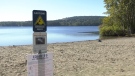 A blue-green algae warning sign is pictured at Elk Lake: Sept. 28, 2020 (CTV News)