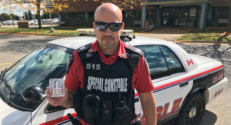 Fanshawe College Special Constable Mike Mahoney holds a naloxone kit in London, Ont. on Tuesday, Sept. 29, 2020. (Sean Irvine / CTV News)