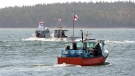 Members of the Potlotek First Nation, head out into St. Peters Bay from the wharf in St. Peter’s, N.S. as they participate in a self-regulated commercial lobster fishery on Thursday, Oct. 1, 2020, which is Treaty Day.  (THE CANADIAN PRESS /Andrew Vaughan)