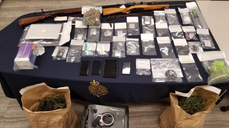 A 27-year-old woman and a 34-year-old man are facing charges after drugs and weapons were seized from a home in Saint-Antoine, New Brunswick on Thursday. (PHOTO VIA N.B. RCMP)