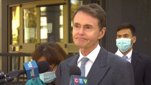 Tony Merchant speaks to reporters outside Court of Queen’s Bench in Sept. 2020.