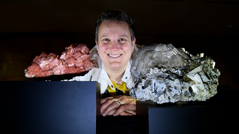 Mineralogist Dr. Paula Piilonen poses with Serandite, left, and Catapleiite minerals, two of a thousand mineral specimens the Canadian Museum of Nature recently acquired from a private collection, at the museum's research and collections facility in Gatineau, Que. on Tuesday, Oct. 6, 2020. The museum acquired the minerals from Mont Saint-Hilaire, Que. collector Gilles Haineault. (THE CANADIAN PRESS/Sean Kilpatrick)
