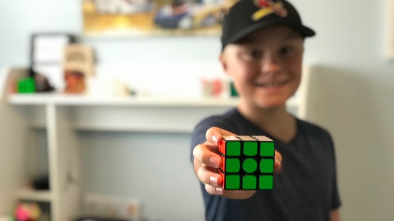 Wyatt Atchison, 12-year-old speedcuber holding a Rubik's cube on October 7, 2020.