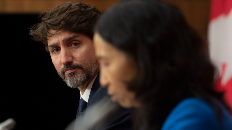 Canadian Prime Minister Justin Trudeau looks on as Chief Public Health Officer Theresa Tam delivers her opening remarks during a news conference Monday October 5, 2020 in Ottawa. THE CANADIAN PRESS/Adrian Wyld