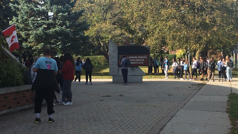 Students gather outside South Collegiate Institute in London, Ont. on Wednesday morning, Oct. 14, 2020. (Brent Lale / CTV News)