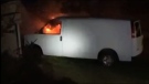 A van is seen on fire in New Edinburgh, N.S., in this still image taken from Facebook video on Oct. 13, 2020. (Riley Howe/Facebook)