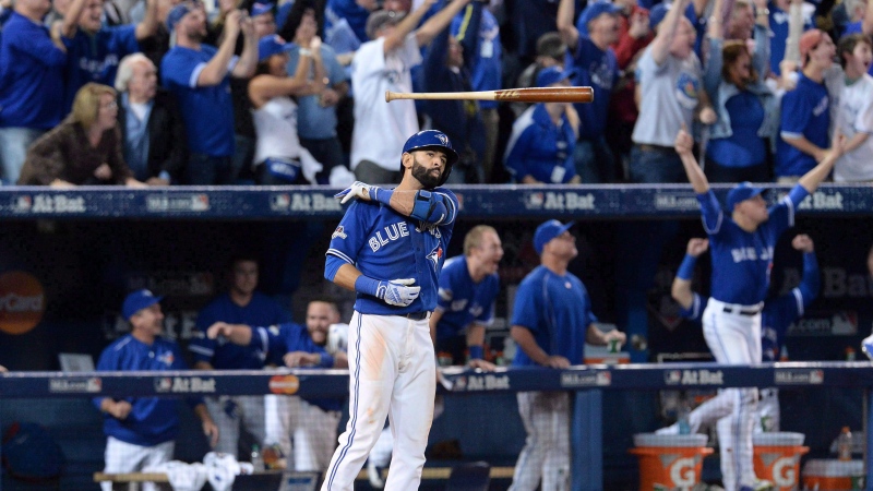 Toronto Blue Jays Jose Bautista flips his bat after hitting a three-run homer during seventh inning game 5 American League Division Series baseball action in Toronto on Wednesday, Oct. 14, 2015. THE CANADIAN PRESS/Chris Young