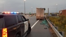 Ontario Provincial Police stop a truck driving erratically on the QEW on Oct. 15, 2020. 