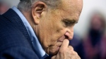Former New York Mayor Rudy Giuliani pauses while addressing supporters of former President Donald Trump supporters Monday, Oct. 12, 2020 during a Columbus Day gathering at a Trump campaign field office in Philadelphia. (AP Photo/Jacqueline Larma)