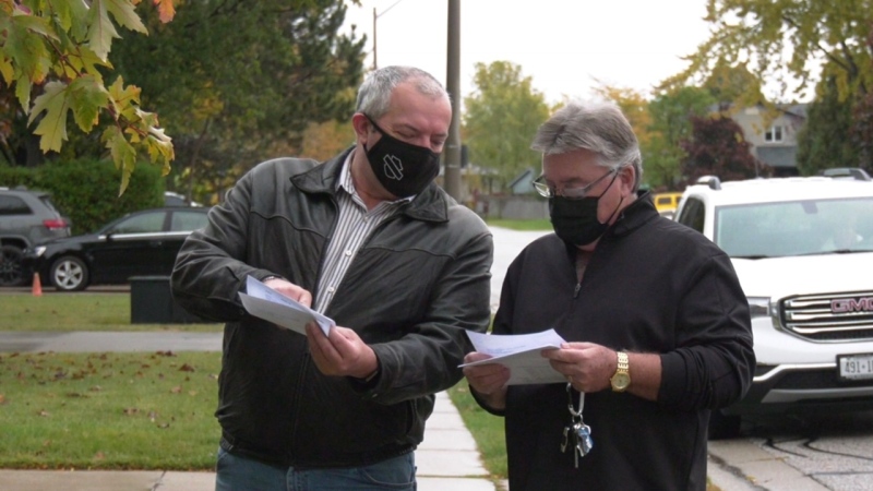 Nelson Gagnon and Shawn Horton expressed concerns over the cost of their most recent water bills in Lakeshore, Ont. on Monday, Oct. 19 2020. (Chris Campbell/CTV Windsor)