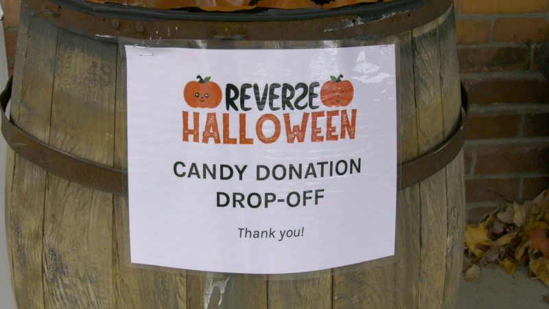 The candy donation barrel in front of the Firehall Theatre in Gananoque, Ont., for donations towards the "reverse Halloween" idea this year. (Nate Vandermeer / CTV News Ottawa)