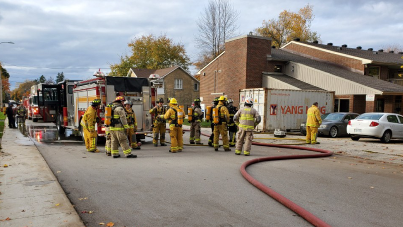 Fire crews clean up the scene following an apartment fire in Minto, Ont. on Tuesday, Oct. 20, 2020. (OPP Twitter)