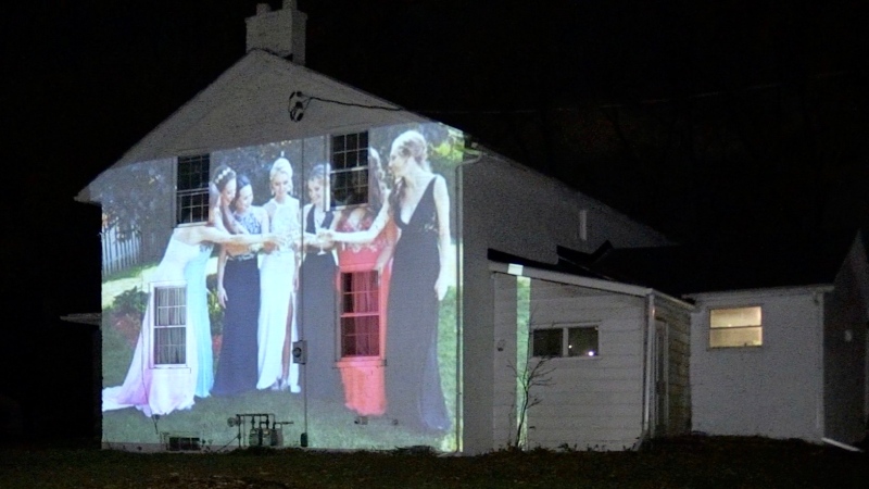 A photo is projected onto the historic Clarke House in London, Ont. on Tuesday, Oct. 20, 2020. (Jim Knight / CTV News)