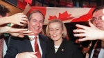 Quebec Liberal leader Daniel Johnson makes his way through a crowd of supporters with his wife Suzanne Marcil after the No victory in the Quebec referendum Monday night in Montreal. (CP PHOTO) 1995) 1995 (Jacques Boissinot)