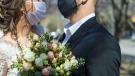People wear face masks at a wedding. (Shutterstock)