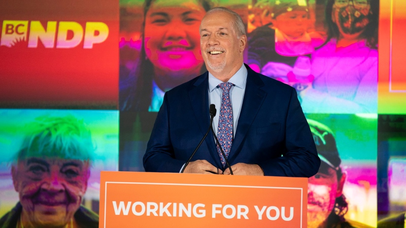 NDP Leader John Horgan celebrates his election win in the British Columbia provincial election in downtown Vancouver, B.C., Saturday, Oct. 24, 2020. (THE CANADIAN PRESS / Jonathan Hayward)
