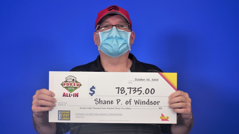 Lotto winner Shane Poisson of Windsor picking up his cheque at the OLG centre in Toronto, Ont. (courtesy OLG) 