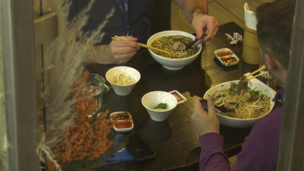 Customers eating inside an Edmonton restaurant