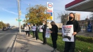 Protestors took to an Esso gas station in Windsor, Ont to protest the controversial Alaskan Iditarod dog-sled race on Wednesday, Oct. 28 2020. (Alana Hadadean/CTV Windsor)