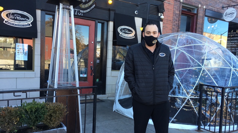 Vito's Pizzeria manager Marco Maggio in front of a patio igloo in Windsor, Ont. on Monday, Nov. 2, 2020. (Chris Campbell/CTV Windsor)