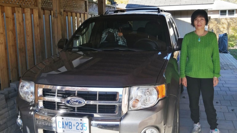 Tian Liang is seen in this undated photograph beside her vehicle. (Pat Foran/CTV News Toronto)