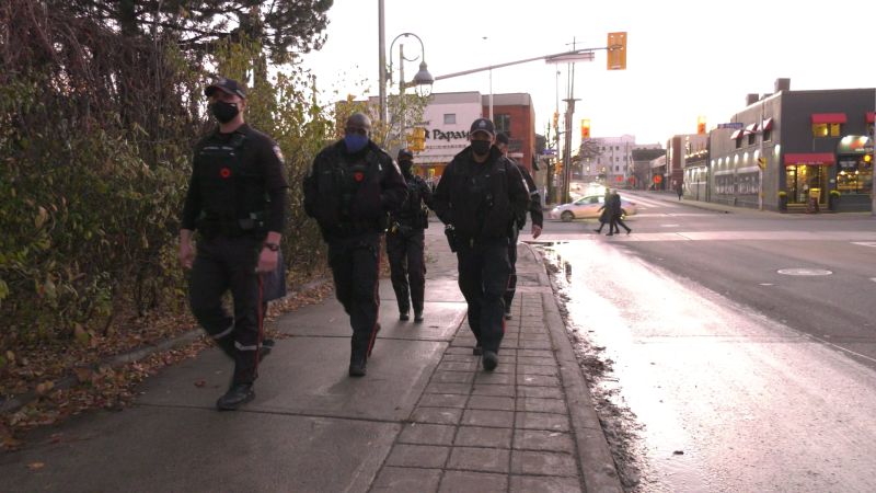 Ottawa Police Neighbourhood Resource Team officers walking in Little Italy. (Shaun Vardon/CTV News Ottawa)