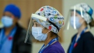 Respiratory registered nurse Angeline Kurian, who works on a COVID-19 floor, wears personal protective equipment as she has a coffee break at the Humber River Hospital during the COVID-19 pandemic in Toronto on Thursday, November 5, 2020. THE CANADIAN PRESS/Nathan Denette