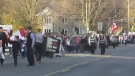 Protesters march in an anti-COVID-19 restrictions rally in Aylmer, Ont. on Nov. 7, 2020. 