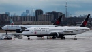 Air Canada airplanes sit on the tarmac at Pearson International Airport in Toronto on Friday, March 20, 2020. (Nathan Denette/The Canadian Press)
