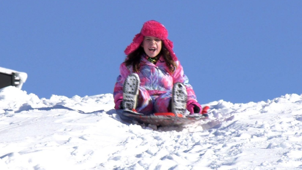 Gemma Neufeld sledding
