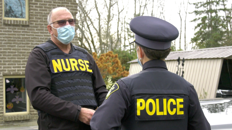 Nurse Don Depratto talks with another officer from the OPP mobile crisis response unit. (Nate Vandermeer / CTV News Ottawa)