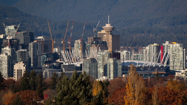 The downtown skyline including BC Place stadium, condo towers and numerous construction cranes is seen from Queen Elizabeth Park in Vancouver on Sunday, Nov. 8, 2020. (Darryl Dyck / THE CANADIAN PRESS)