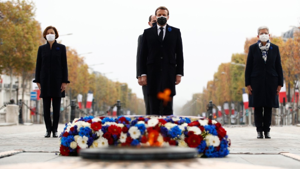French President Emmanuel Macron, centre, in Paris