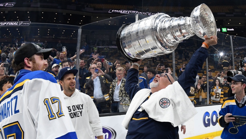 Rick Schwartz (right) lifts the Stanley Cup after his son Jaden and the St. Louis Blues claimed the trophy in 2019. Rick passed away suddenly on Nov. 9, 2020. (Facebook/St Louis Blues) 