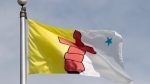 Nunavut's provincial flag flies on a flag pole in Ottawa, Tuesday June 30, 2020. THE CANADIAN PRESS/Adrian Wyld