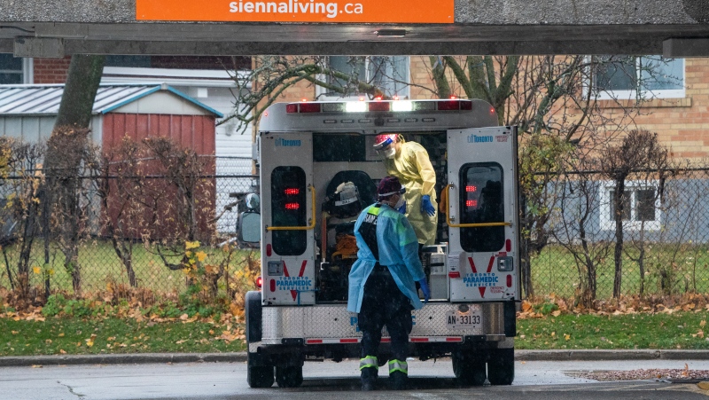 Paramedics arrive at the Rockcliffe Care Community in Toronto on Sunday November 15, 2020. The residence has had over 200 residents and staff test positive for COVID-19 with 7 deaths. THE CANADIAN PRESS/Frank Gunn
